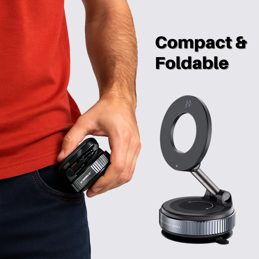 Hand holding a compact and foldable device with a stand on a light gray background